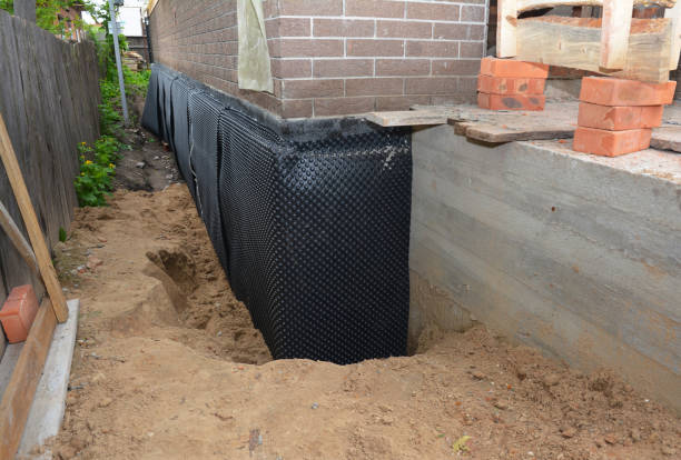 Happy homeowners after waterproofing job in Rising Sun
